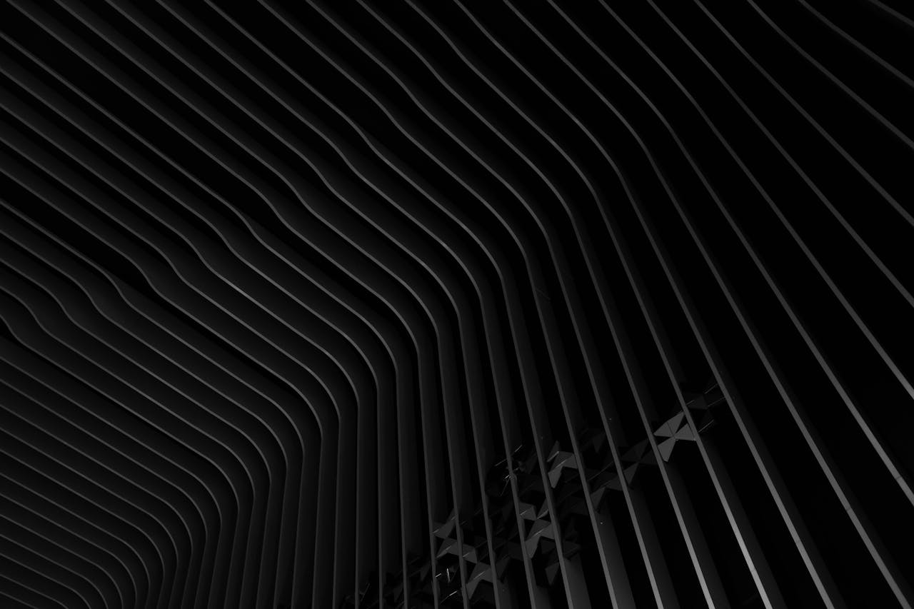 Abstract image featuring a dark, metallic, and patterned design with a captivating texture.